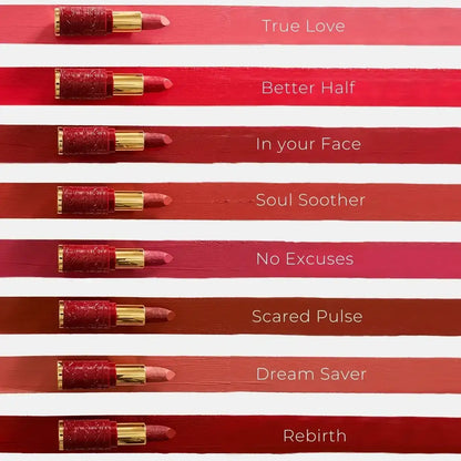 Queen Of Hearts creme lipstick shade lineup with eight red tubes and pink swatches