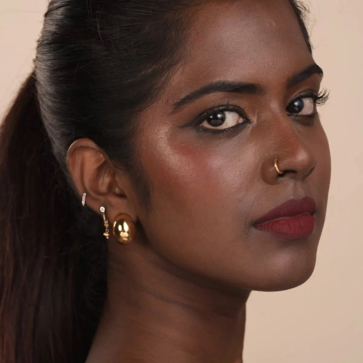 Matte lip mousse lipstick on lips in deep burgundy