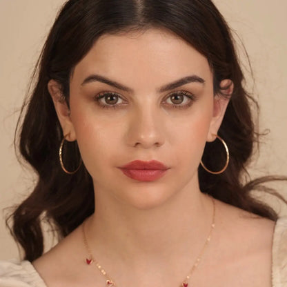 Matte SPF lip mousse lipstick with natural rose-nude lip color on a model