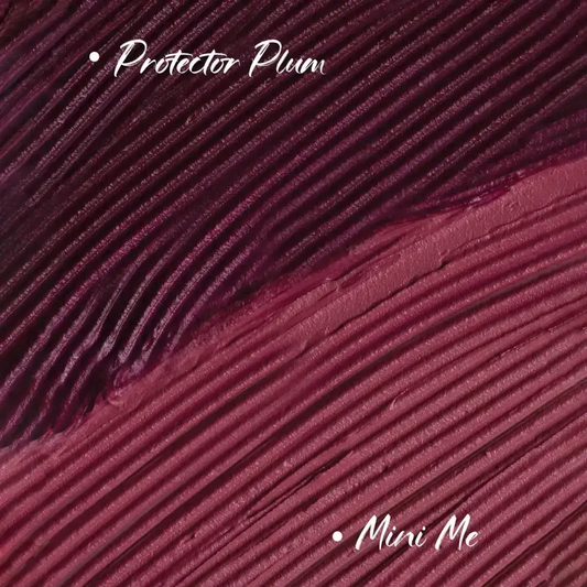 Lipstick tubes not visible; plum textured fabric background