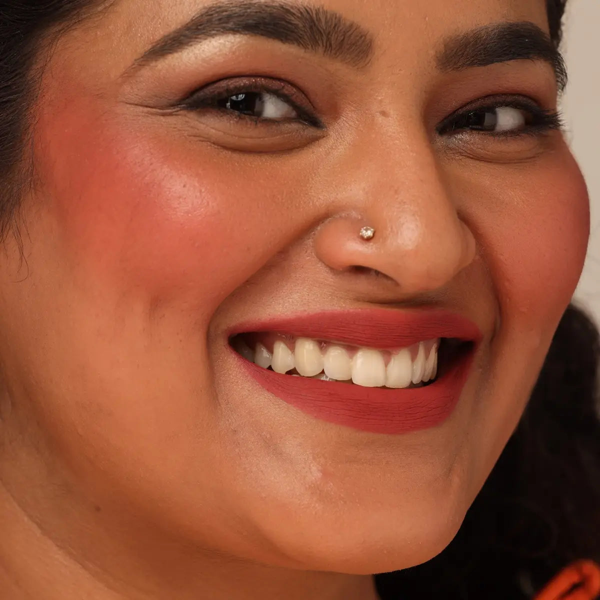 Blush duo makeup on model face, rose blush cheeks with matching red lips