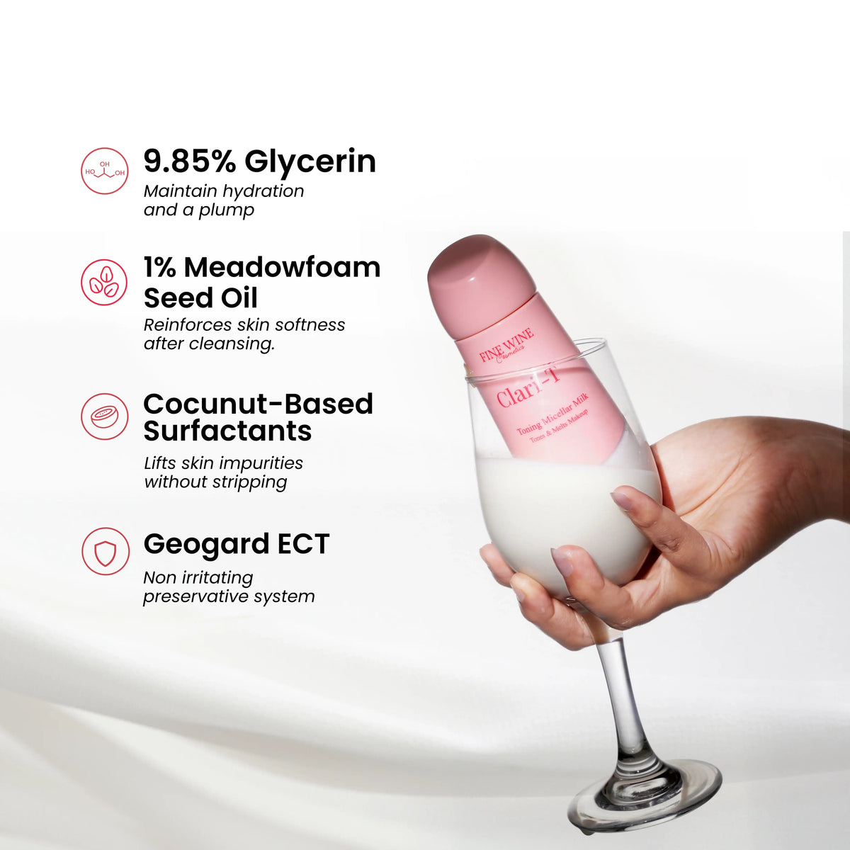 Clari-T toning micellar milk bottle held in a hand.