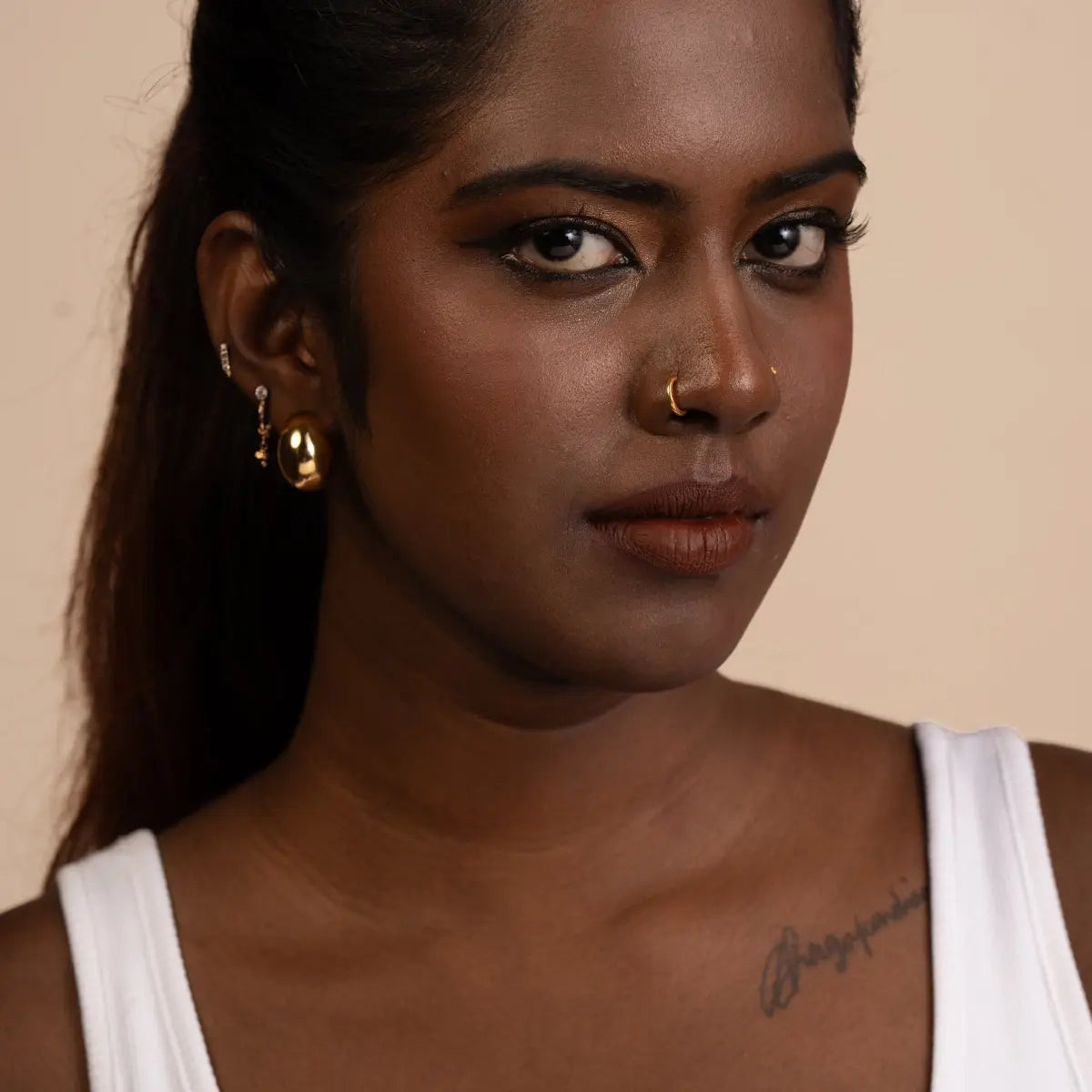 Matte lip mousse lipstick on lips in dark brown-red