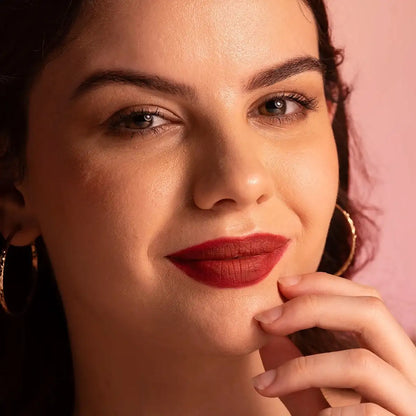 Matte SPF lip mousse lipstick on model with deep red-burgundy matte lips